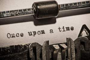 Paper in a typewriter with "Once upon a time" typed out.